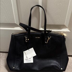 NWT Calvin Klein Black Shoulder Bag never used.Paid $150.Long strap is missing.